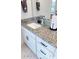 Bathroom with granite countertop, white cabinets, and black accents at 1077 Hearth Sw Ln, Concord, NC 28025