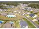 Aerial view of house, neighborhood, and community pool at 7112 Irongate Dr, Indian Land, SC 29707