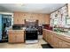 Galley kitchen with gas stove, microwave, and ample counter space at 1118 Wall St, Statesville, NC 28677