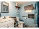 Clean bathroom with a toilet, sink, shower, and grab bar at 1118 Wall St, Statesville, NC 28677