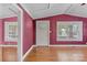 Living room with wood floors and pink walls at 114 Corban Se Ave, Concord, NC 28025