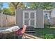 Exterior view of a gray storage shed with double doors at 114 Corban Se Ave, Concord, NC 28025