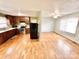 Open concept kitchen and living area with hardwood floors at 2223 Chatham St, Newton, NC 28658