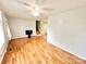 Hardwood floor living room with stairs and ceiling fan at 2223 Chatham St, Newton, NC 28658