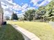 Large fenced backyard with a grassy area and a walkway at 2223 Chatham St, Newton, NC 28658