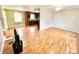 Open concept living and kitchen area with hardwood floors at 2223 Chatham St, Newton, NC 28658