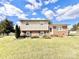 Brick ranch home with a well-maintained lawn and landscaping at 2223 Chatham St, Newton, NC 28658