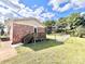 Back deck with steps leading to the grassy backyard at 2223 Chatham St, Newton, NC 28658