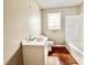 Clean bathroom with a bathtub, sink, and toilet at 2223 Chatham St, Newton, NC 28658
