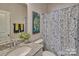 Small bathroom with granite countertop and shower/tub combo at 132 Balboa St, Matthews, NC 28104