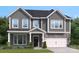 Two story home with gray siding and white trim at 132 Balboa St, Matthews, NC 28104