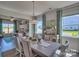 Bright dining room featuring a large table, hardwood floors, and plenty of natural light at 132 Balboa St, Matthews, NC 28104