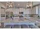 Modern kitchen with large island, granite countertops, and white shaker cabinets at 132 Balboa St, Matthews, NC 28104