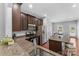 Modern kitchen with dark cabinets and granite countertops at 3157 Delaware Dr, Denver, NC 28037