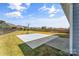 Backyard oasis featuring a basketball court and fire pit area at 3157 Delaware Dr, Denver, NC 28037