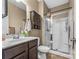 Bathroom features a shower/tub combo, vanity with dark wood cabinets, and a toilet at 3157 Delaware Dr, Denver, NC 28037