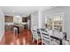 Eat-in kitchen with island, stainless steel appliances, and dark wood cabinets at 3157 Delaware Dr, Denver, NC 28037