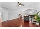 Bright living room with hardwood floors, sectional sofa, and large windows at 3157 Delaware Dr, Denver, NC 28037