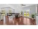 Spacious living room with hardwood floors, sectional sofa, and large windows at 3157 Delaware Dr, Denver, NC 28037