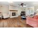 Spacious living room with hardwood floors, a brick fireplace, and ample natural light at 502 Downing Dr, Kings Mountain, NC 28086