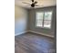 Simple bedroom with ceiling fan and large window at 615 Sandycrest Dr, Cherryville, NC 28021