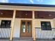 Inviting front porch with double doors and wood ceiling at 615 Sandycrest Dr, Cherryville, NC 28021