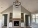 Open living area featuring a brick fireplace and high ceilings at 615 Sandycrest Dr, Cherryville, NC 28021