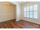 Dining room with hardwood floor and large window with shutters at 17228 Hampton Trace Rd, Huntersville, NC 28078