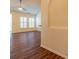 Spacious living room with hardwood floors and a ceiling fan at 17228 Hampton Trace Rd, Huntersville, NC 28078