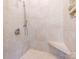 Walk-in shower with tiled walls and built-in seat at 1709 Brookshaw Run, Fort Mill, SC 29715