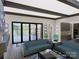 Open living room with modern fireplace and access to backyard patio at 1007 Kingbird Ln, Clover, SC 29710