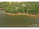 Lakefront lot with sandy beach and wooded area at 1007 Kingbird Ln, Clover, SC 29710