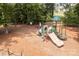 Community playground with playset, swings, and wood chip surface at 1007 Kingbird Ln, Clover, SC 29710