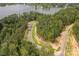 Lakefront lot with wooded area and private access road at 1007 Kingbird Ln, Clover, SC 29710
