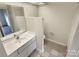 Clean bathroom with single sink vanity and tiled floor at 1831 J Julian Ln # A, Charlotte, NC 28208
