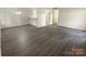 Spacious living room with hardwood-look flooring and plenty of natural light at 1831 J Julian Ln # A, Charlotte, NC 28208
