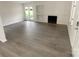 Living room with fireplace and hardwood floors at 1831 J Julian Ln # A, Charlotte, NC 28208