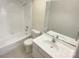Clean bathroom with a bathtub, toilet and vanity at 1831 J Julian Ln # A, Charlotte, NC 28208