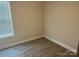 Bedroom with wood-look flooring and closet at 177 Rhuidean Ct, Troutman, NC 28166