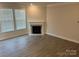 Living room featuring a fireplace and hardwood floors at 177 Rhuidean Ct, Troutman, NC 28166