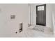 Clean laundry room with gray tile floor and built in washer/dryer space at 736 Cedar St, Rock Hill, SC 29730
