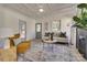 Living room boasts a coffered ceiling, fireplace and access to front porch at 736 Cedar St, Rock Hill, SC 29730