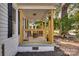 Inviting front porch with wooden columns and railings at 736 Cedar St, Rock Hill, SC 29730