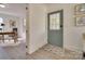 Light and bright entryway with a view into an office and a blue door at 736 Cedar St, Rock Hill, SC 29730