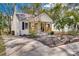 Charming white cottage with a front porch and landscaped yard at 736 Cedar St, Rock Hill, SC 29730