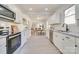 Bright and spacious kitchen with an open layout and white cabinetry at 736 Cedar St, Rock Hill, SC 29730