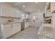 Renovated kitchen with granite countertops, stainless steel appliances, and white shaker cabinets at 736 Cedar St, Rock Hill, SC 29730