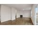 Living room with fireplace, hardwood floors, and sliding glass doors at 4012 Parsons Field Ct, Maiden, NC 28650