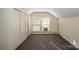 Bedroom with carpet, double closet and window at 223 N Oak St, Statesville, NC 28677