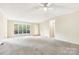 Bright living room with large window and carpeted floor at 1472 Fritts Ave, Fort Mill, SC 29715